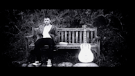 James Fisher as Jonah on a bench with his guitar, Grasmere Lake District, October 2011 - Black Smoke Rising